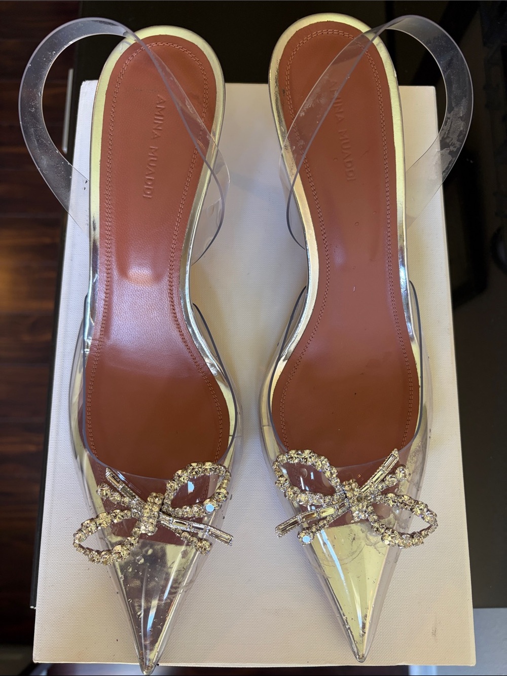 Amina Muaddi Clear PVC Slingback Pumps with Crystal Bow